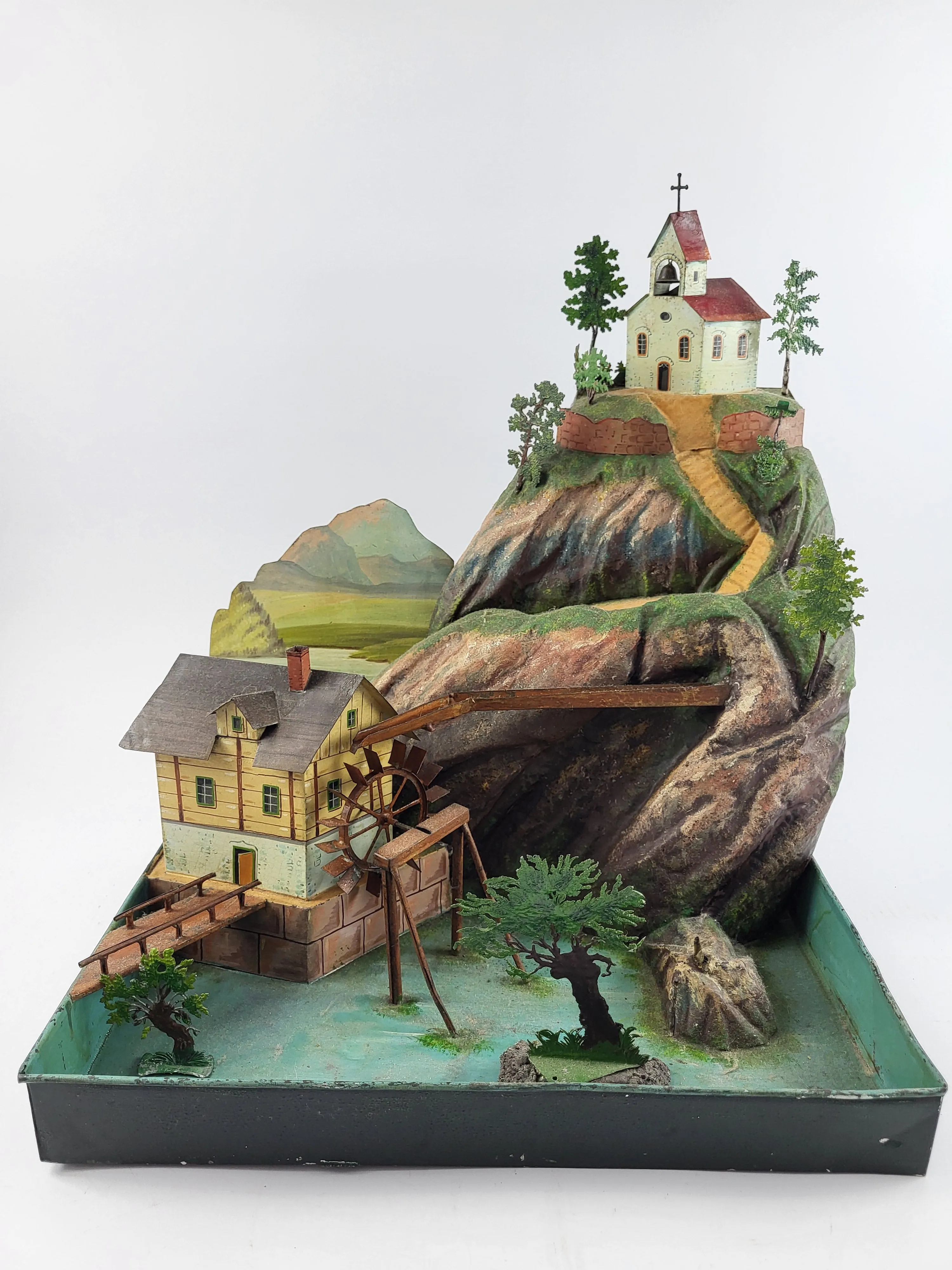 Rock & Graner mountain landscape with watermill and church